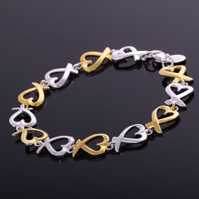 solid silver and gold heart bracelet